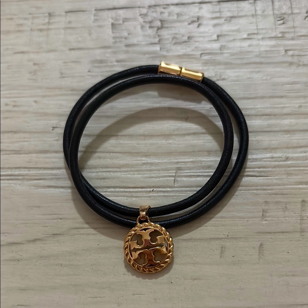 Tory Burch Black and Gold Bracelet with Elegant Charm